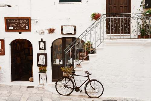 street black bicycle near handrails at daytime bike