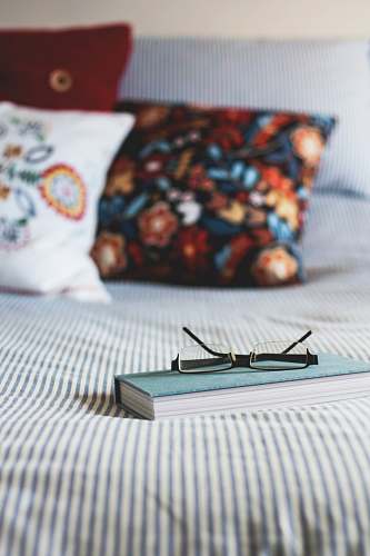 home eyeglasses on book reading