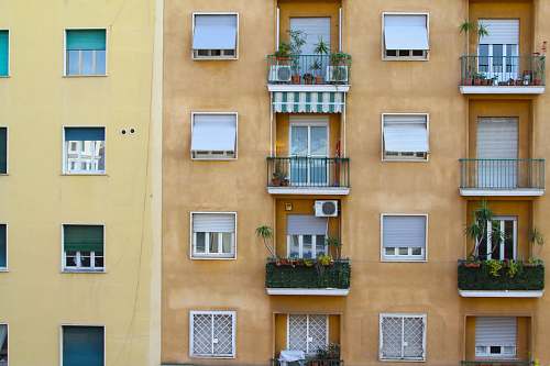 balcony yellow high-rise building rome