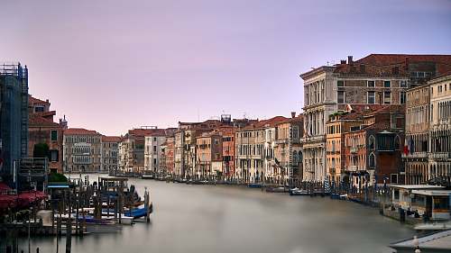italy body of water surrounded by houses boat