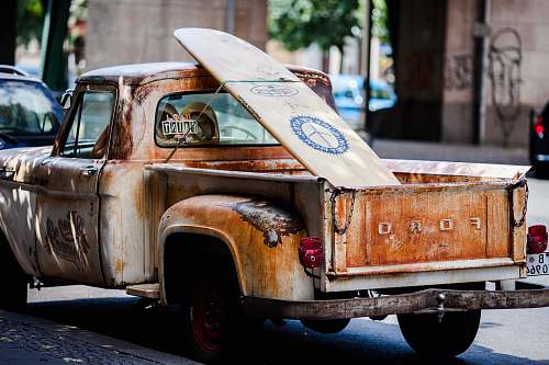 transportation vintage brown and white Ford single-cab pickup truck parked on pavements vehicle