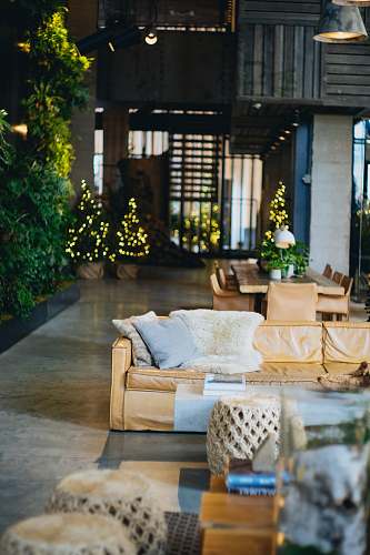 furniture brown couch with blue and white pillows patio