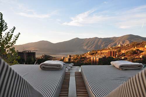 mexico sunloungers fronting buildings near mountain luxury