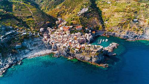 nature aerial photography of houses on hilltops near the ocean vernazza