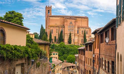 building landscape photography of village siena
