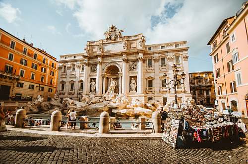 architecture man standing in front of statue rome