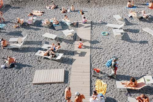 beach people on gray sand beach summer