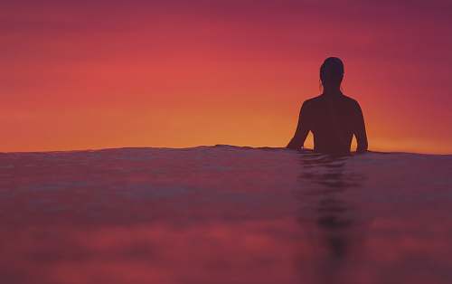 human silhouette of person floating on body of water people
