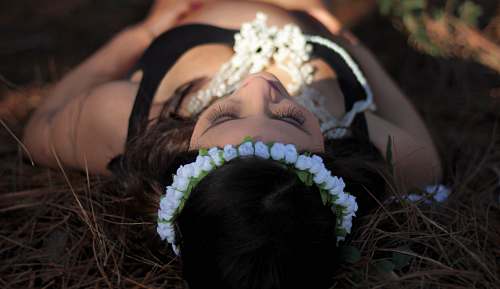 woman woman lying down on brown grass outdoor girl