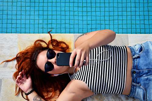 woman woman lying on brown floor people