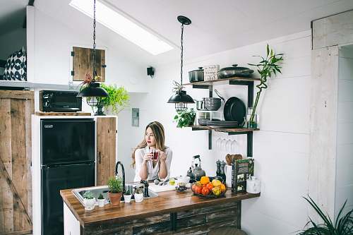 human woman sitting in front of table furniture