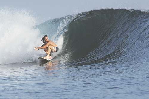surfing man surfing with big wave ocean