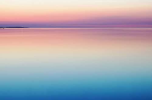 horizon photo of blue and pink sea pastel