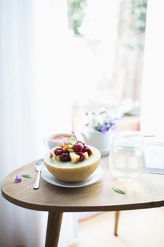 food dessert dish filled white plate beside spoon table
