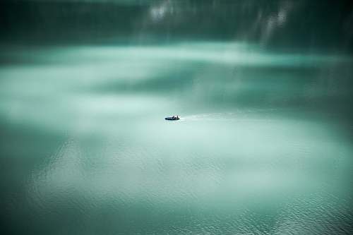 kandersteg aerial photography of sailing boat at sea water