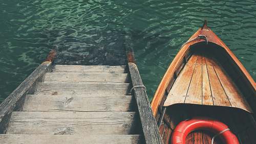 italy boat near wooden stairs boat