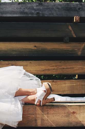 heels person wearing brown-and-white chunky heels during daytime bride