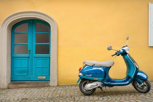 bamberg blue scooter motorcycle outside house germany