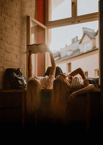 book girls reading book while lying reading