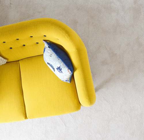 interior yellow fabric sofa with throw pillow home