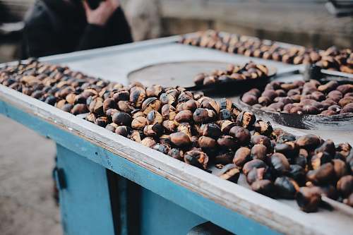 human brown and black coffee beans on table person