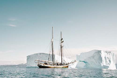 transportation boat approaching iceberg vehicle