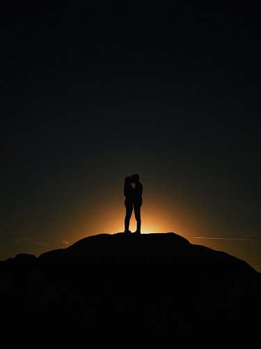 silhouette man and woman kissing love