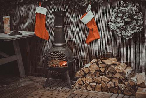 symbol firewood in black chiminea fireplace