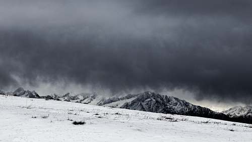 weather sand field and mountains on background storm