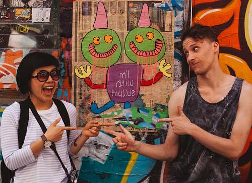 person couple near mural apparel