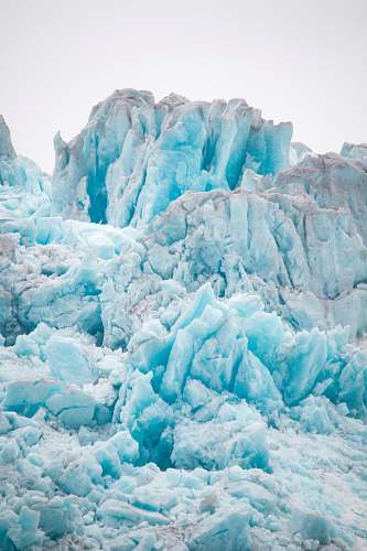 glacier snow covered mountain during daytime snow