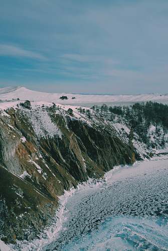 nature snow-covered mountain near ocean mountain
