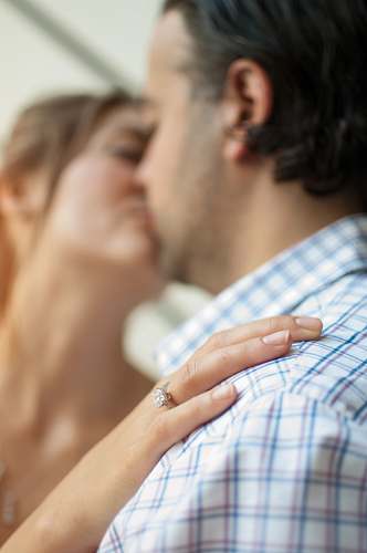 human man kissing woman person