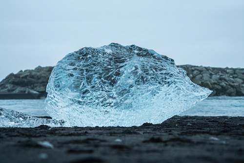 ice glass leaf on black surface outdoors