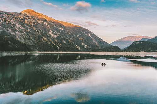 mountain landscape photography of mountain near body of water lake