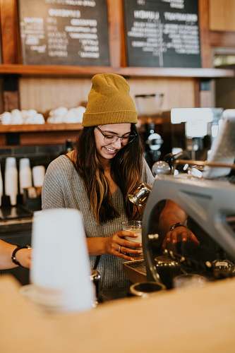 human woman holding clear drinking glass person