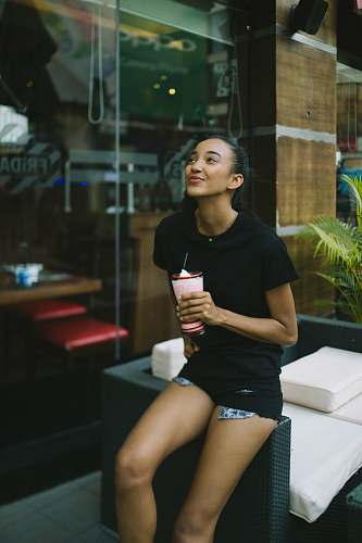 person woman holding shake cup woman