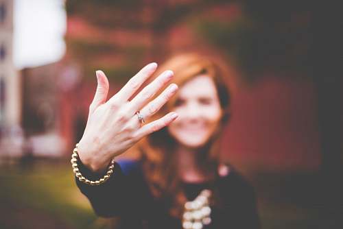 human woman showing silver-colored ring person