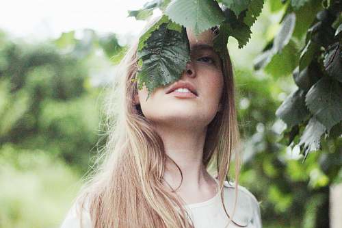 woman woman standing near green leaf tree human