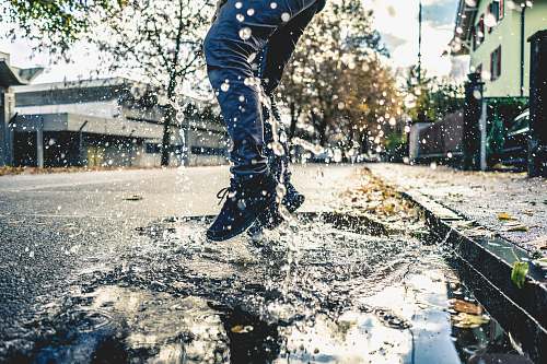 switzerland person making splash on water puddle on road thun
