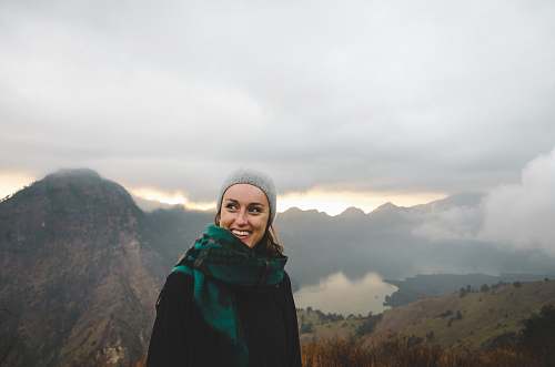 people woman wearing green scarf smiling female