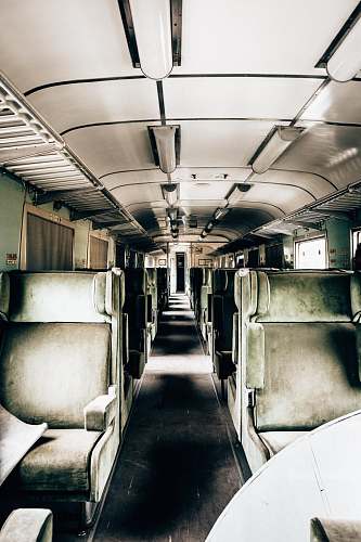 train green and white train interiors vehicle
