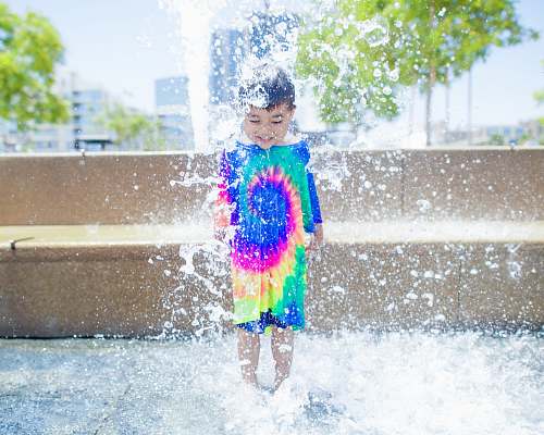 person boy standing on water kid