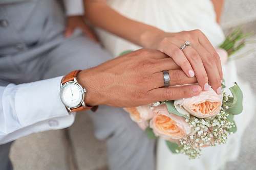 hands man and woman holding hands flowers