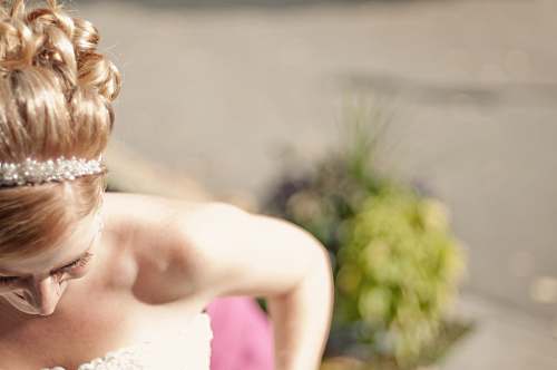 wedding woman in white floral strapless sweetheart bridal gown shallow focus photography headband