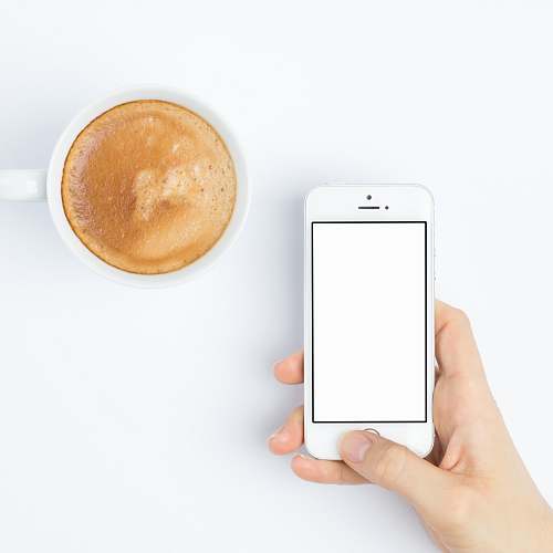  person silver iPhone 5s beside white ceramic mug 