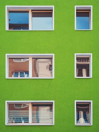 window architectural photography of green house with windows green