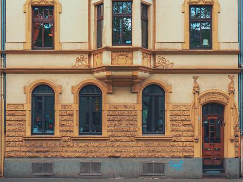 facade closeup photo of yellow concrete house köln