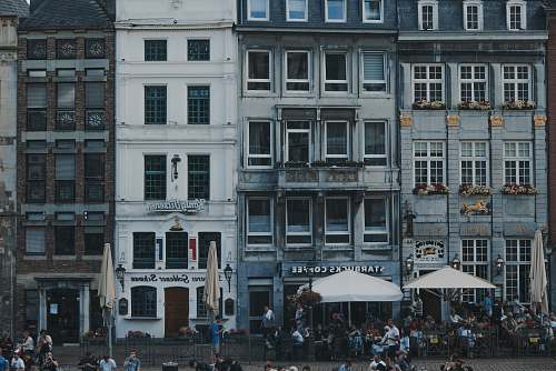 restaurant white patio umbrellas in front of buildings aachen
