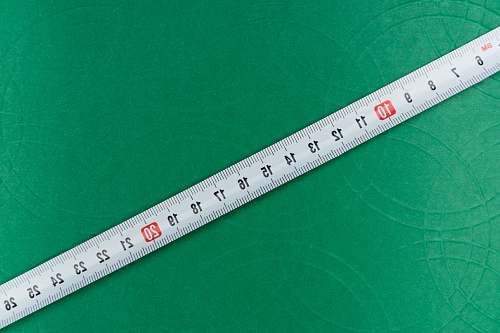 diagram white ruler on green textile measurements